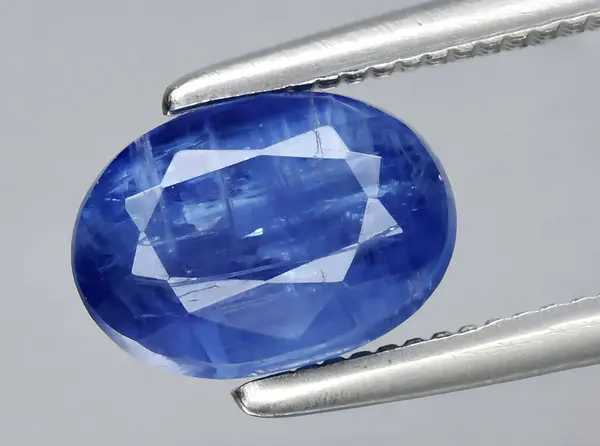 stock image natural blue kyanite gem on background