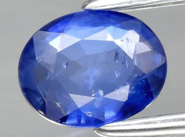 natural blue sapphire gem on background clipart