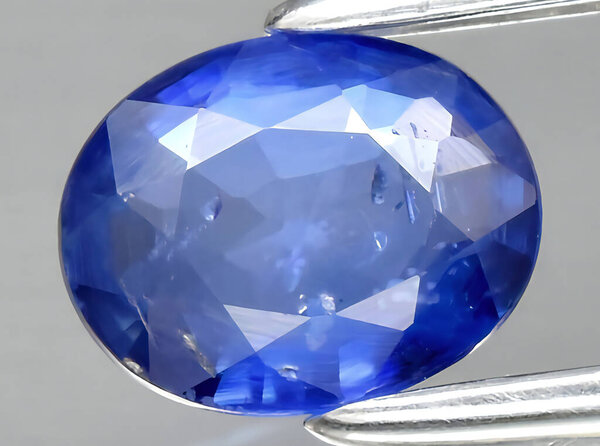 natural blue sapphire gem on background