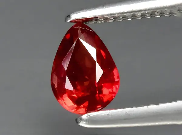 natural red sapphire gem on background