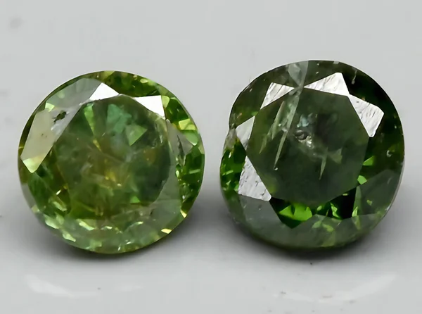 natural green diamond gem on background