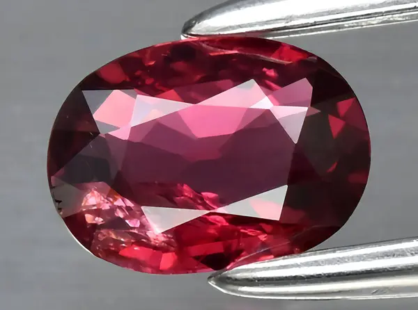 natural red ruby gem on background
