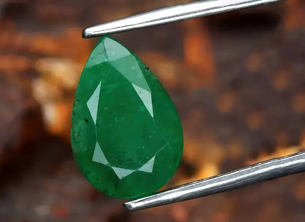 natural green emerald beryl gem on background
