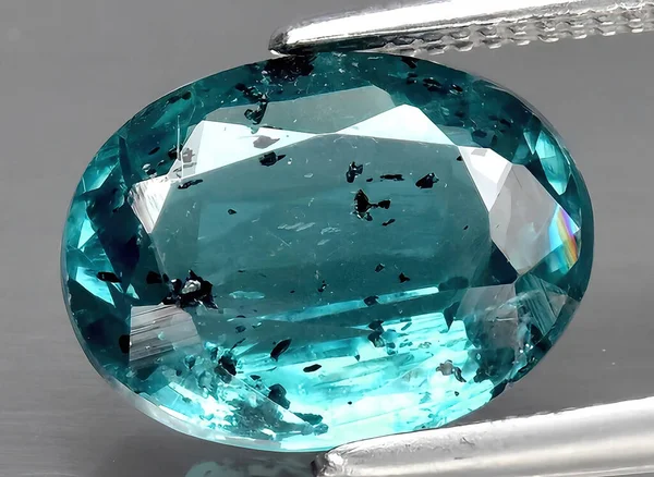 natural green blue kyanite gem on background