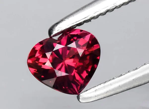 natural pink ruby gem on background