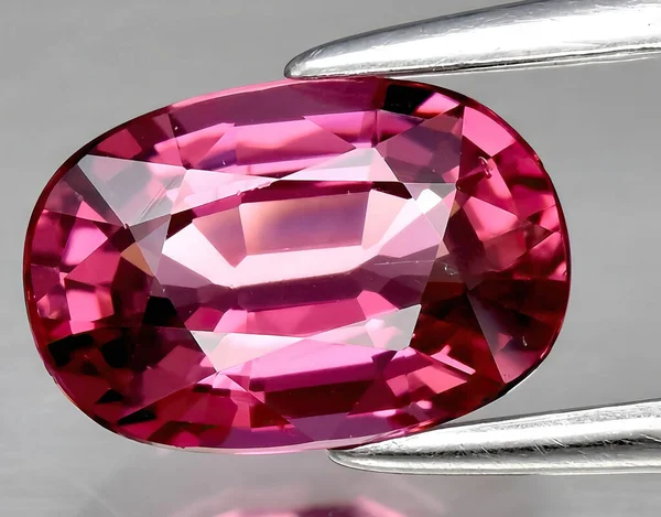 natural pink rhodolite gem on background