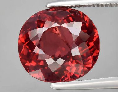 natural red pyrope garnet gem on background clipart