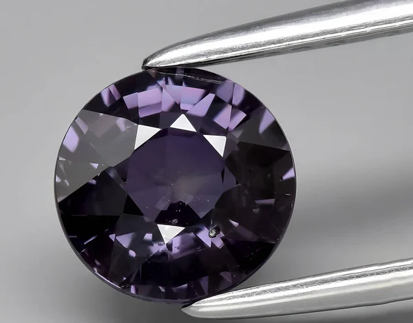natural purple sapphire gem on background