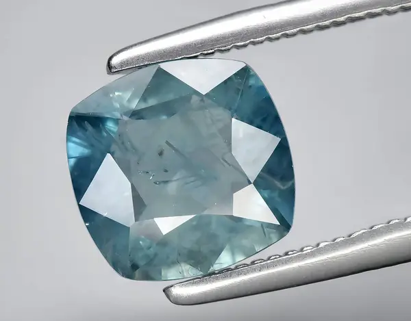 natural green blue sapphire gem on background