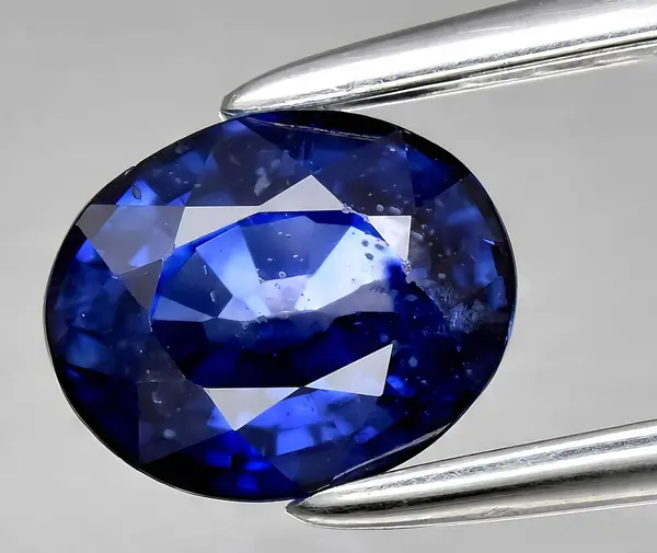 natural blue sapphire corrundum gem on background