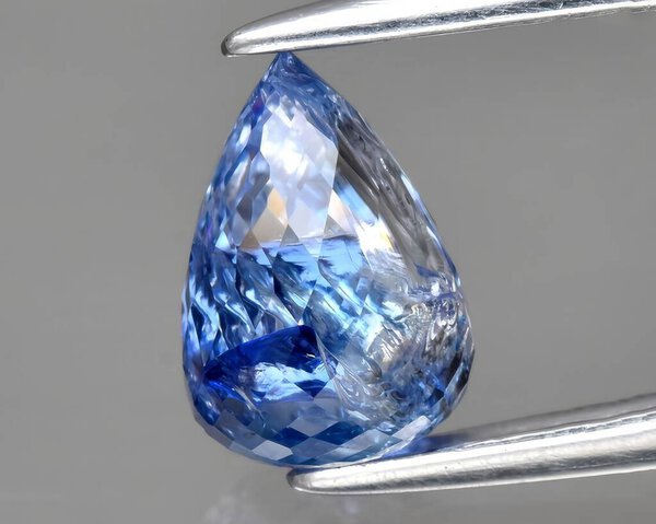 natural blue sapphire gem on background