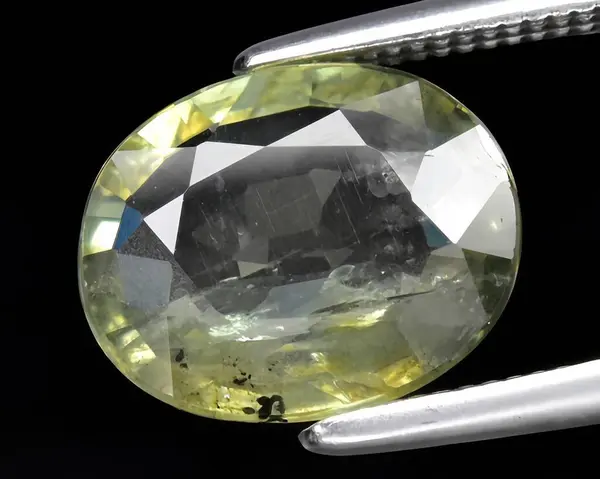 natural green sapphire gem on background
