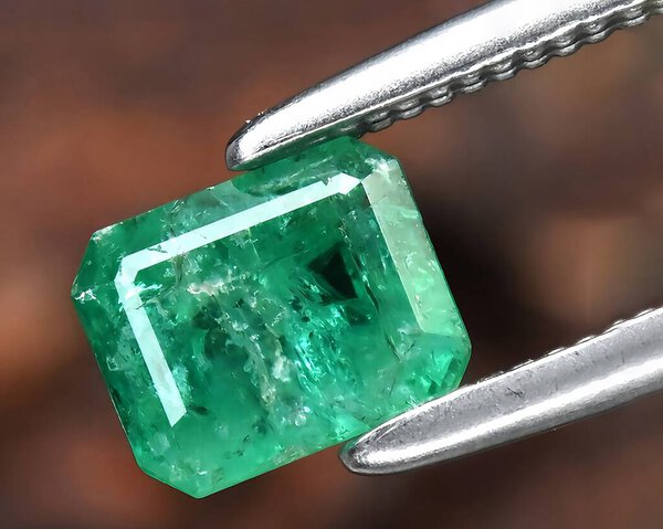 natural green dioptase gem on background