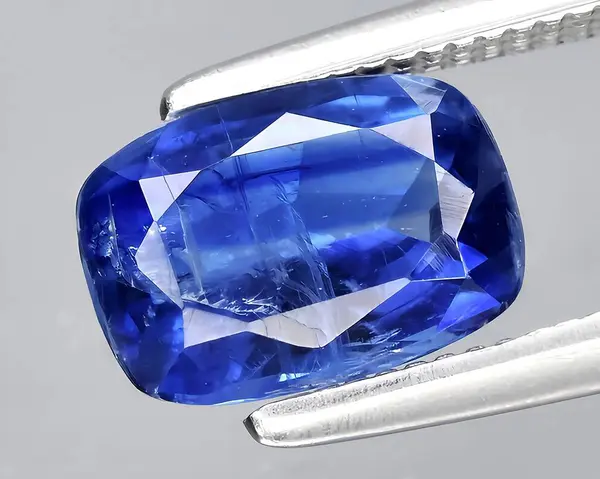 natural blue kyanite gem on background