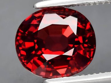 natural red rhodolite garnet gemstone on background clipart