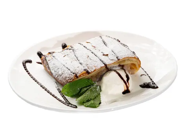 stock image Decadent Apple Strudel with Vanilla Ice Cream and Chocolate Drizzle on Elegant White Plate.