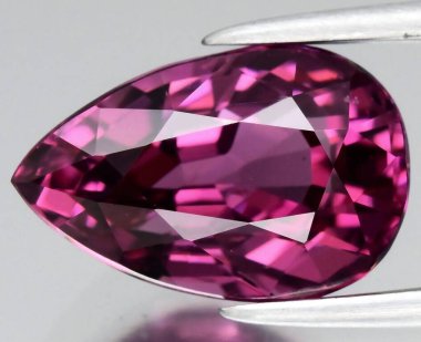 Exquisite Purple Spinel Gemstone with Intricate Faceting and Brilliant Luster. clipart