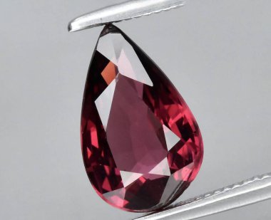 Exquisite Drops of Nature's Artistry: A Radiant Teardrop Cut Natural Gemstone in Stunning Pink Hues. clipart