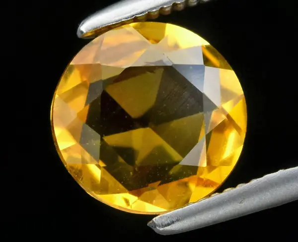 stock image Radiant Faceted Yellow Natural Citrine Gemstone Displayed with Precision.