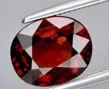 Exquisite Deep Red Gemstone Radiating Elegance and Intrigue. clipart