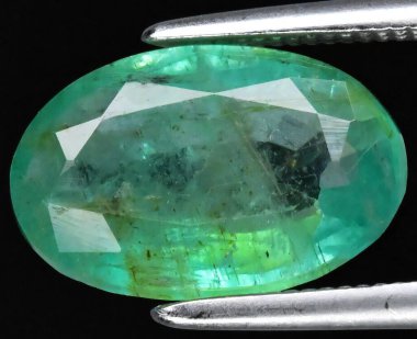 Exquisite Emerald Gemstone Displayed Under Light. clipart