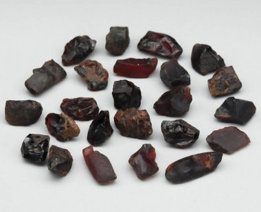 A Stunning Array of Raw Garnet Crystals Showcasing Nature's Rich Colors and Textures. clipart