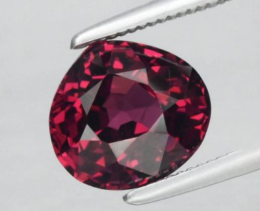 Radiant Deep Red Gemstone Captured in a Gleaming Light Reflection. clipart