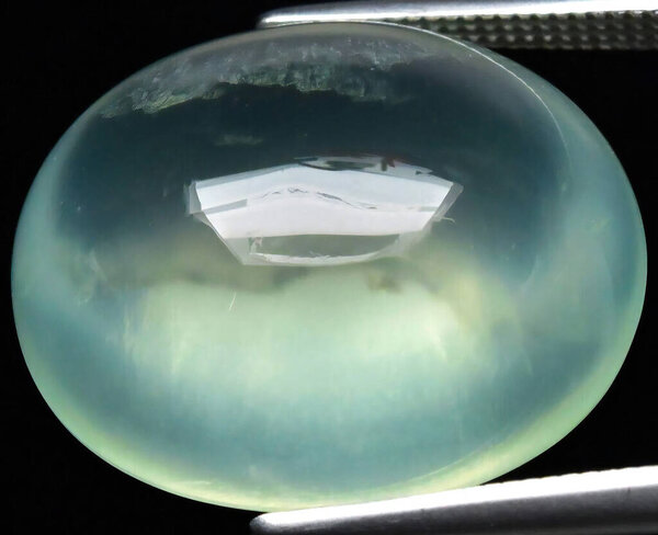 Ethereal Blue Green Gemstone with Luminous Depths.