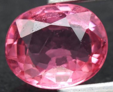 Glimmering Pink Tourmaline Gemstone on Display. clipart