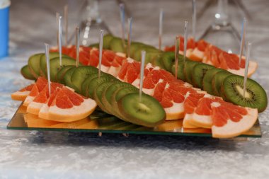 Colorful Fruit Platter Featuring Grapefruit and Kiwi Slices. clipart