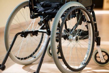 A Close-Up of a Modern Wheelchair with Detailed Wheel Mechanism. clipart