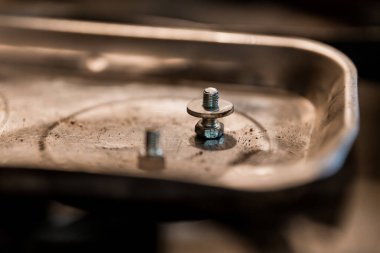 Close-up of Metal Bolts and Washers on a Stainless Steel Tray. clipart