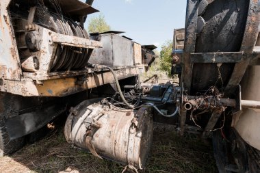 Rusty Machinery in Abandoned Agricultural Setting. clipart