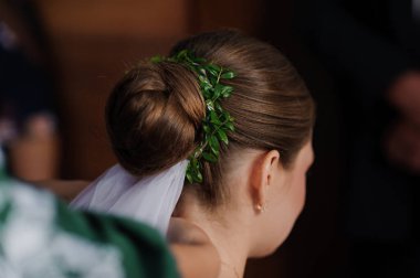 Elegant Bride with Floral Hairpiece and Classic Bun Hairstyle. clipart