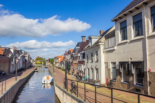 stock image Boats in the canal of the historic village Kollum, Netherlands