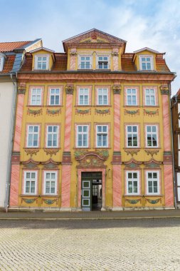 Front facade of a colorful hous on the Untermarkt square in Muhlhausen, Germany clipart