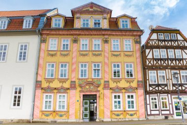 Front facade of colorful houses on the Untermarkt square in Muhlhausen, Germany clipart