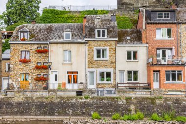 Old houses on the quayside in La Roche-en-Ardenne, Belgium clipart