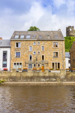 Historic stone house at the riverbank in La Roche-en-Ardenne, Belgium clipart