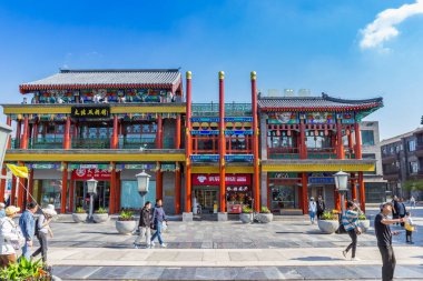 Colorful shops in the touristic Qianmen street in Beijing, China clipart