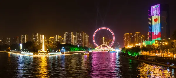 stock image Panoramic night view over the illuminated ferris wheel in Tianjin, China