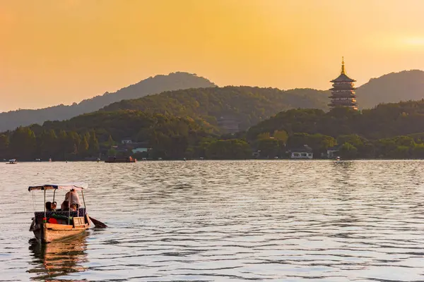 stock image Wooden boat in sunset on the West Lake in Hangzhou, China