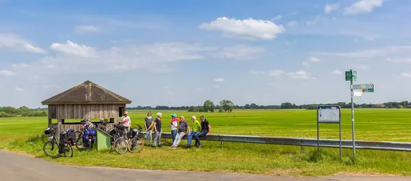 stock image Panorama of cyclists resting and road sign near Papenburg, Germany