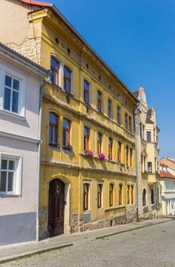 Historic house at a cobblestoned street in Litomerice, Czech Republic clipart