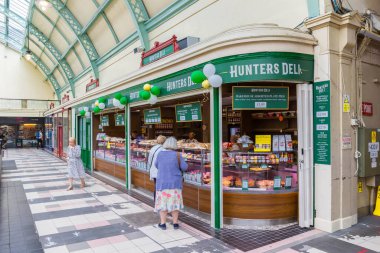 Deli shop in the historic Grainger Market of Newcastle upon Tyne, England clipart