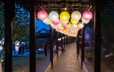 Colorful chinese lanterns at night in the Panmen scenic area in Suzhou, China clipart