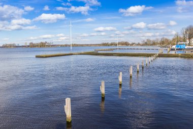 Jetty at the lakeside of the Paterswoldse Meer lake in Paterswolde, Netherlands clipart