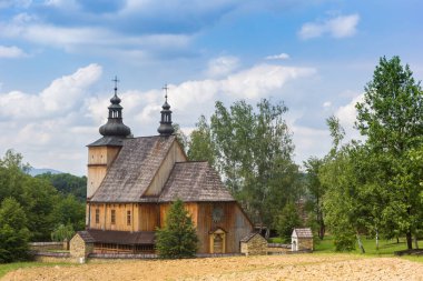 Historic wooden church in the park in Nowy Sacz, Poland clipart