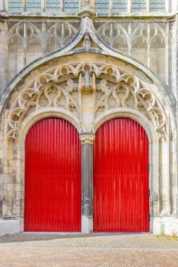 Red doors of the historic Hooglandse kerk church in Leiden, Netherlands clipart