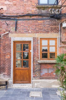 Door and window of a small historic house in Tianzifang, Shanghai, China clipart